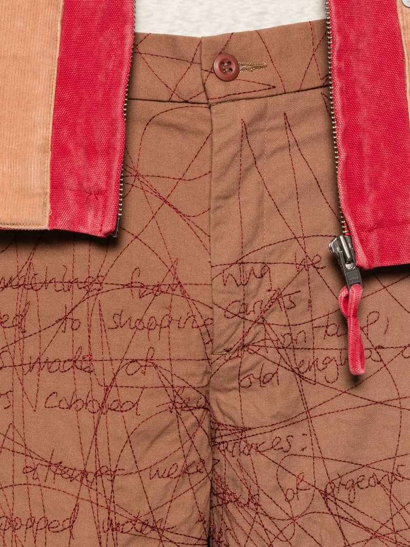 embroidered scribble-pattern trousers 5