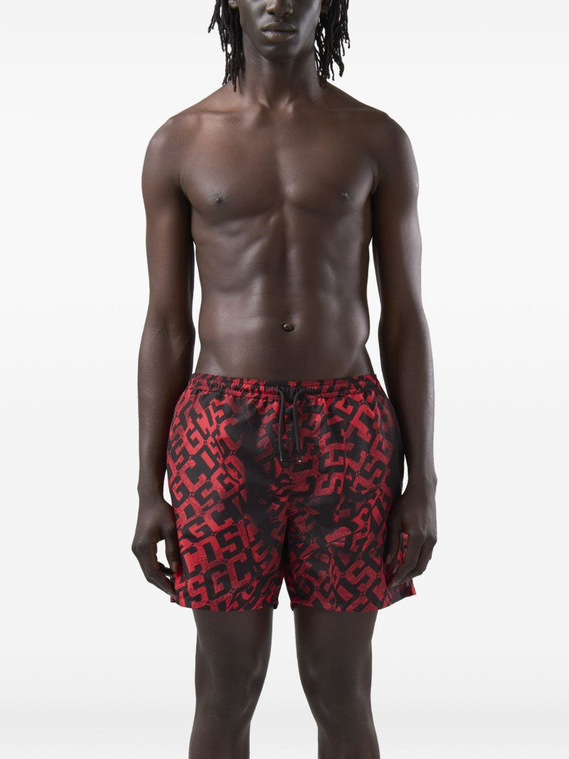 GCDS monogram-print swim shorts outlook