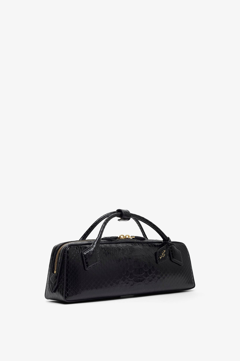 Alaïa Le Teckel black shiny python clutch outlook