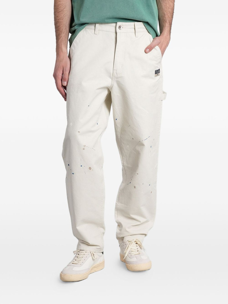 paint-splatter Seagull-print trousers 1