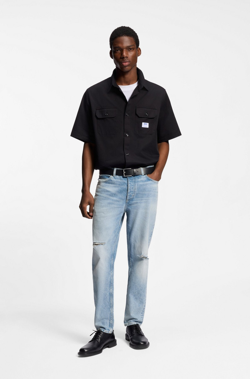 HUGO BLUE TAPERED-FIT JEANS IN DISTRESSED DENIM outlook