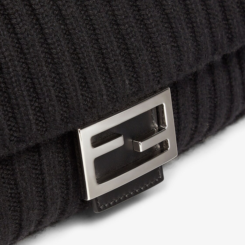 Baguette made of black wool knit with square flap and FF magnetic clasp. Fabric-lined interior with  5