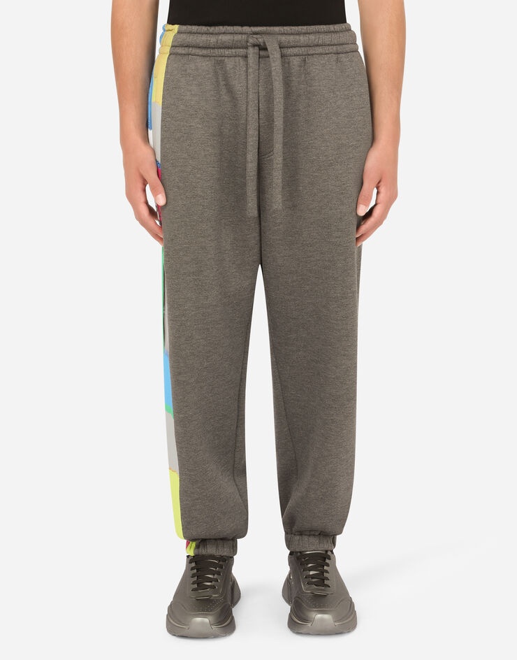 Technical jersey jogging pants with printed band - 1