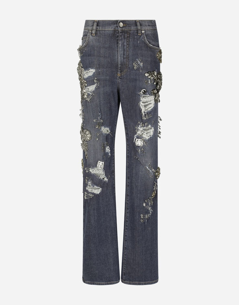 Denim jeans with ripped details and appliqués 1