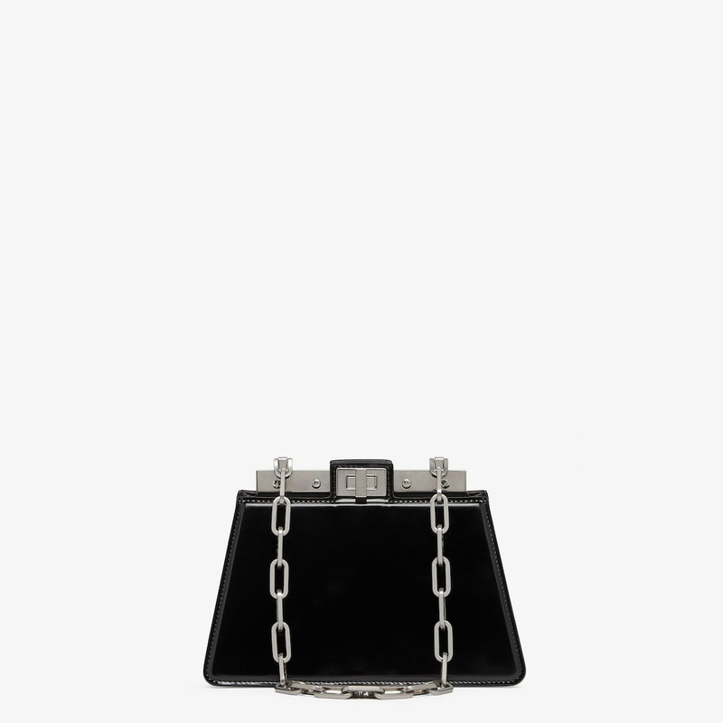 Compact Peekaboo Cut bag made of black leather. A new evolution of the Peekaboo ISeeU, it has a stri 1