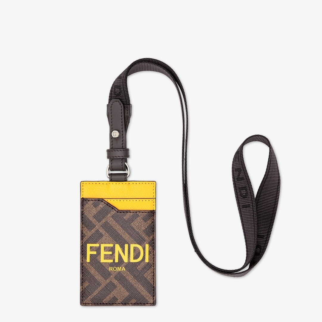 Vertical card holder with 2 slots front and back. Logo webbing strap. Made of textured fabric with b - 1
