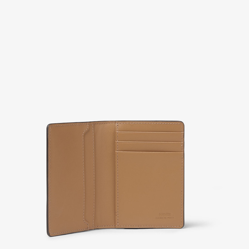 FENDI Bi-fold card holder with three inside card slots and one flat pocket inside and on the back. Made of outlook