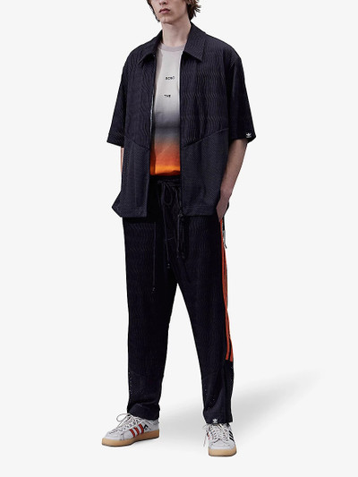 Song for the Mute Song For The Mute x adidas brand-stripe stretch recycled polyester-blend jogging bottoms outlook
