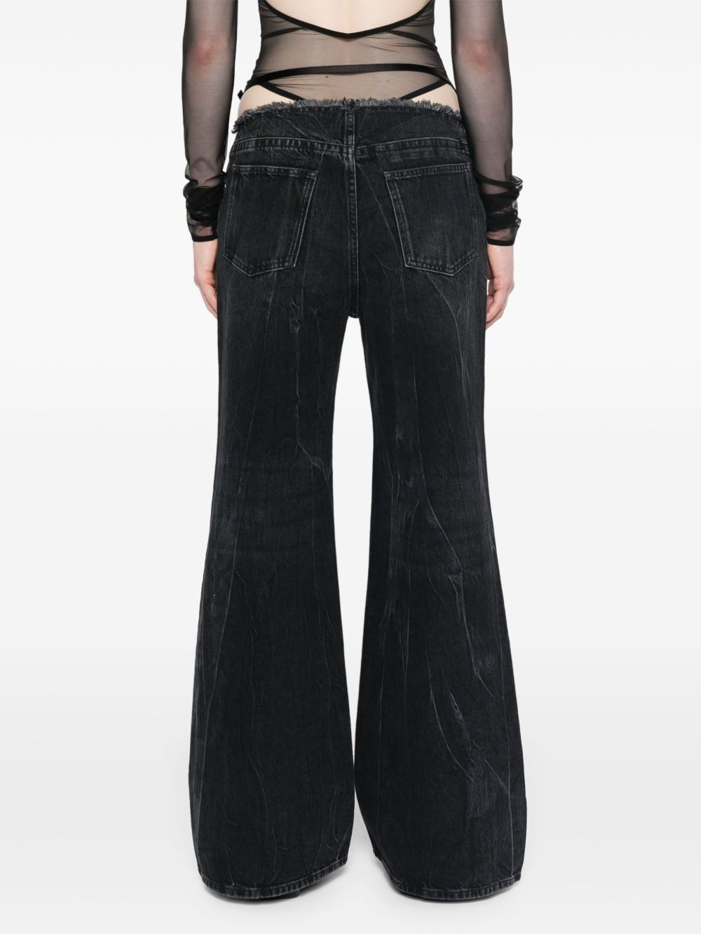 Voyou low-rise flared jeans - 4