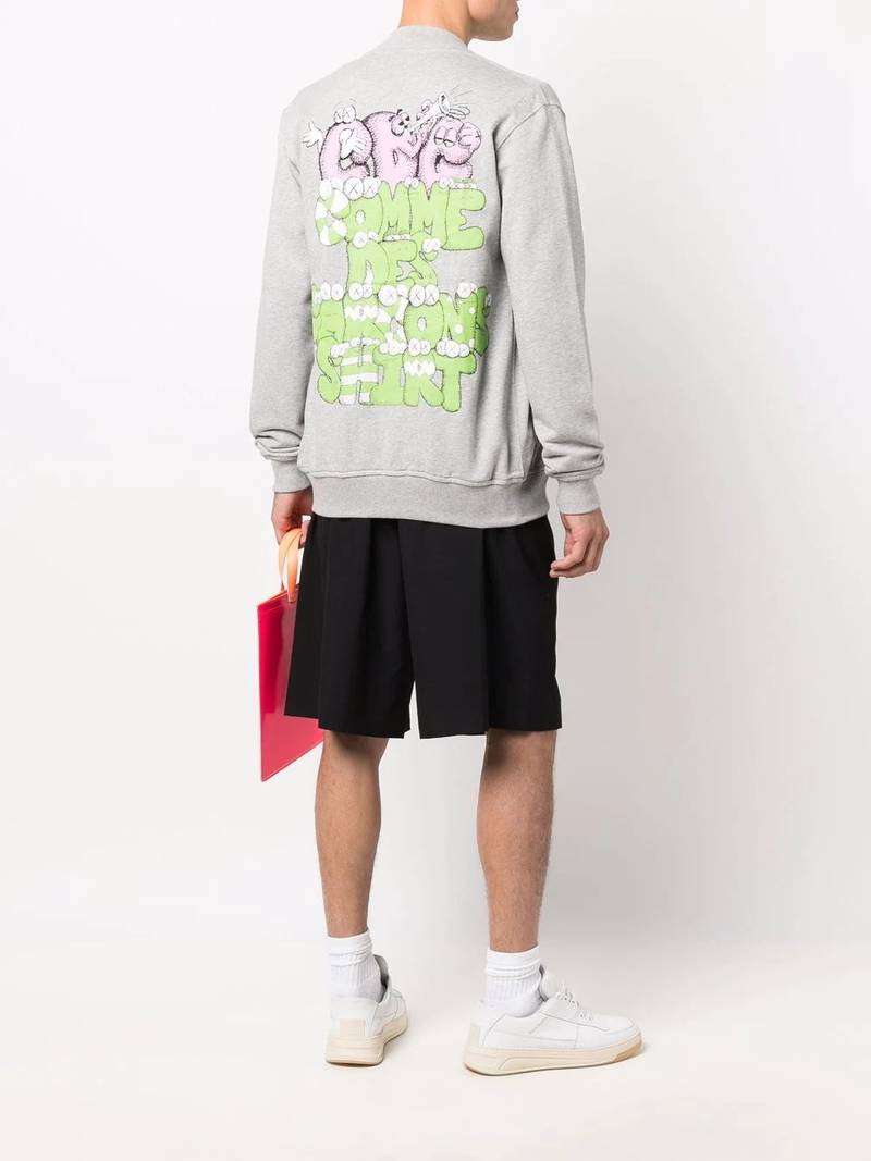 Comme des Garçons SHIRT x Kaws logo-print zip-up jumper outlook