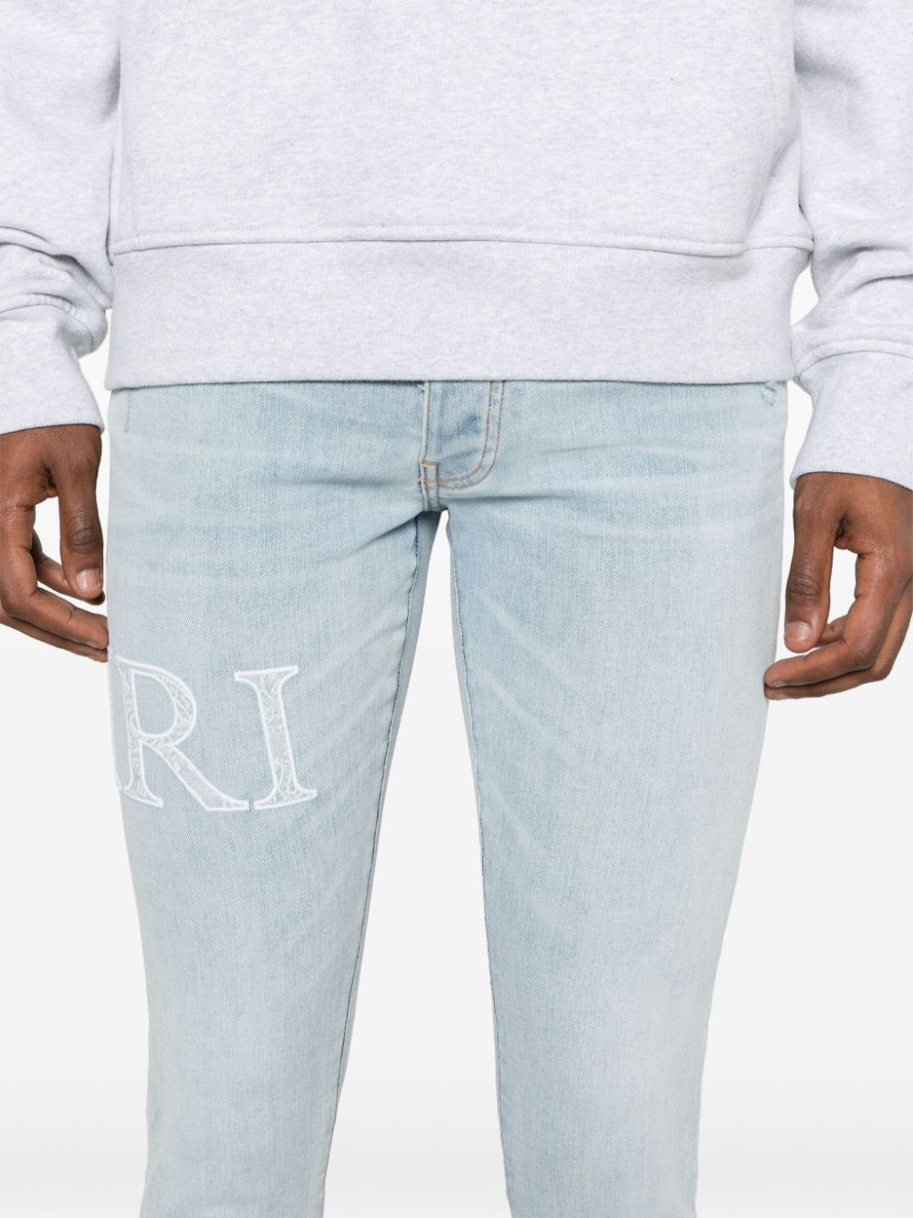 logo-embroidered cotton jeans - 5