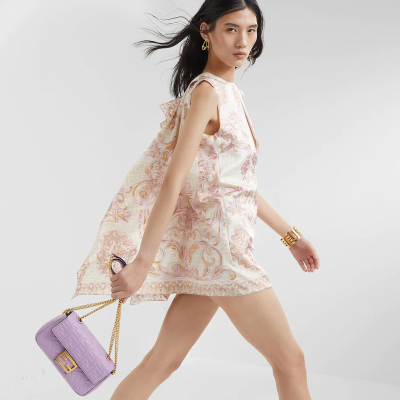 FENDI Medium Baguette bag with chain made of lilac soft nappa leather with a 3D texture FF motif. Decorate outlook