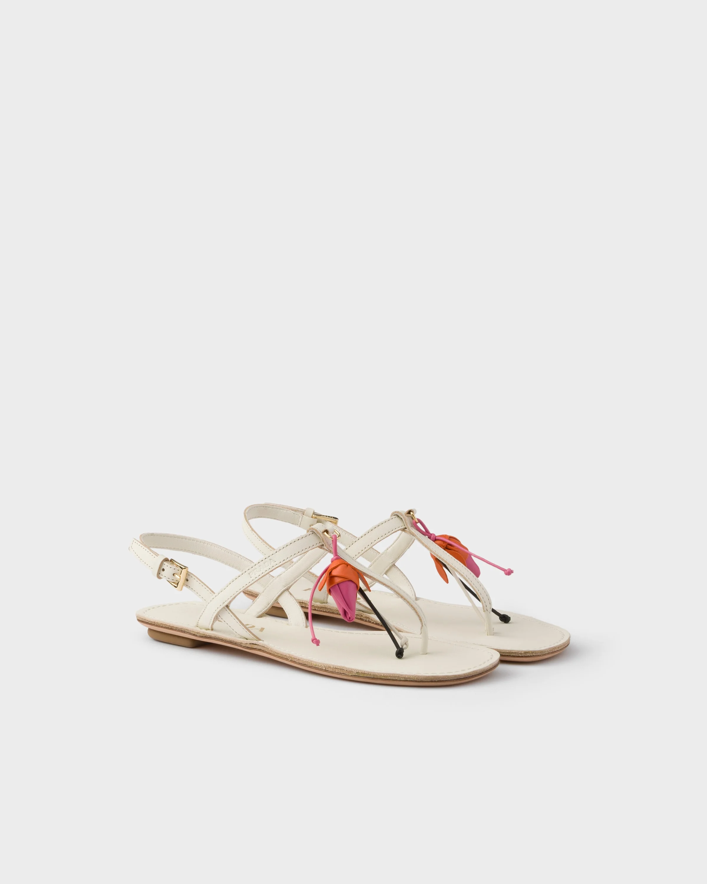 Antiqued leather thong sandals with floral ornament - 1