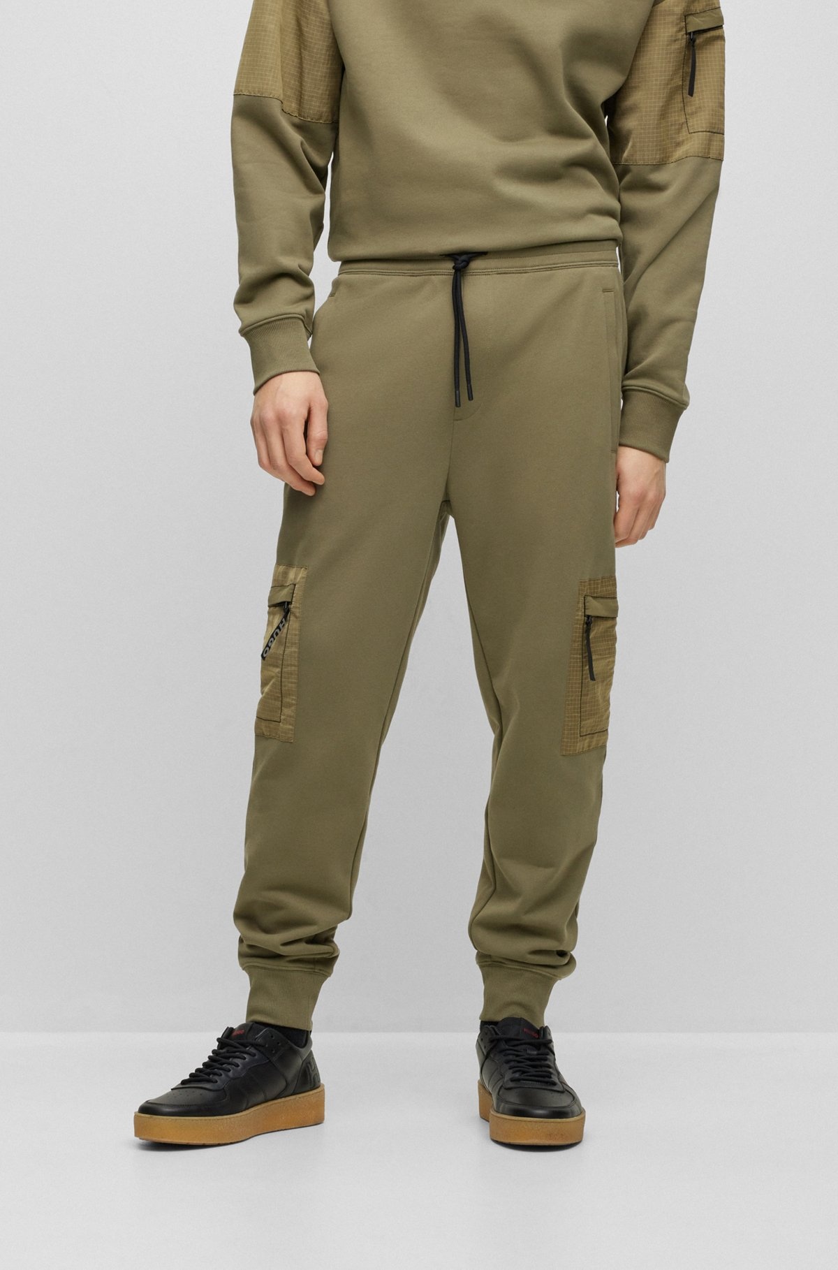 RELAXED-FIT TRACKSUIT BOTTOMS WITH CARGO POCKETS - 2