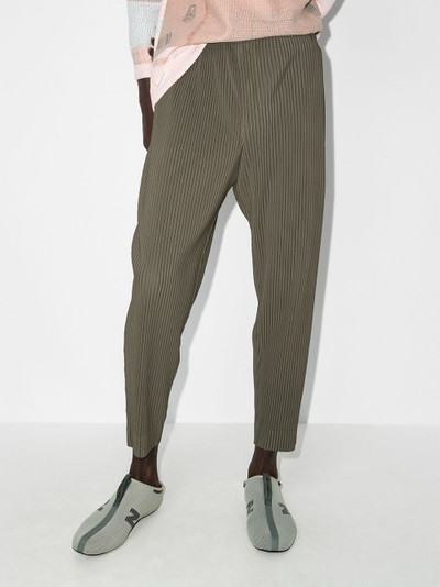 ISSEY MIYAKE tapered-leg plissé trousers outlook