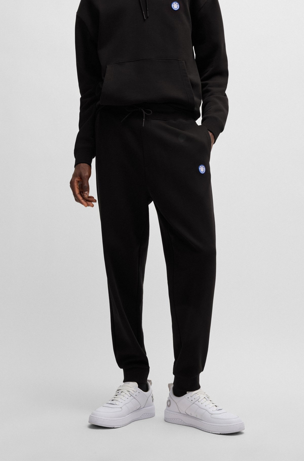 COTTON-TERRY TRACKSUIT BOTTOMS WITH HAPPY HUGO LOGO PATCH - 2