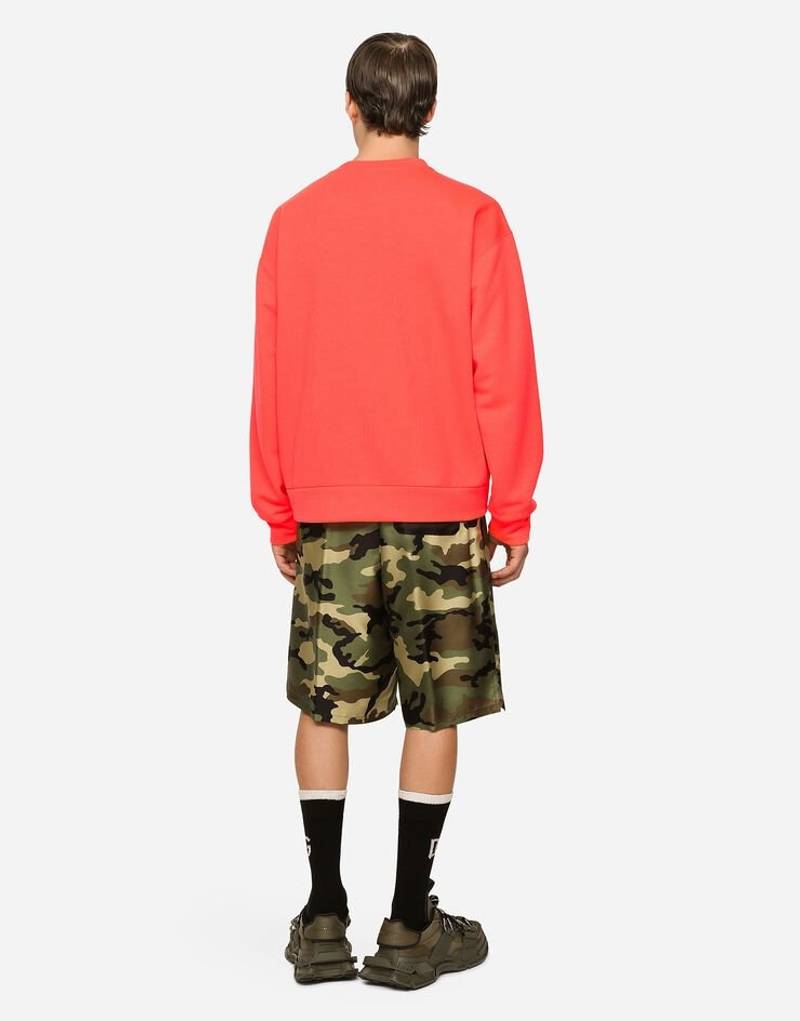 Dolce & Gabbana Silk shorts with camouflage print and patch outlook