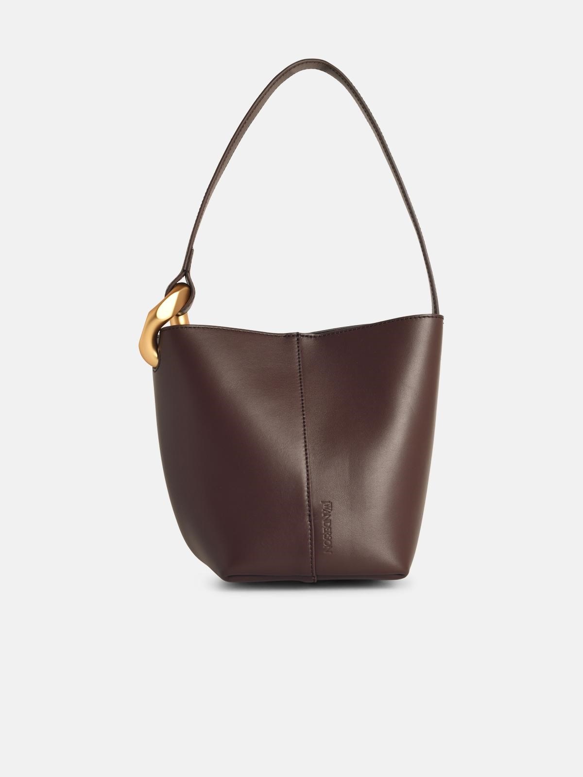 'CORNER' SMALL BROWN LEATHER BUCKET BAG - 1