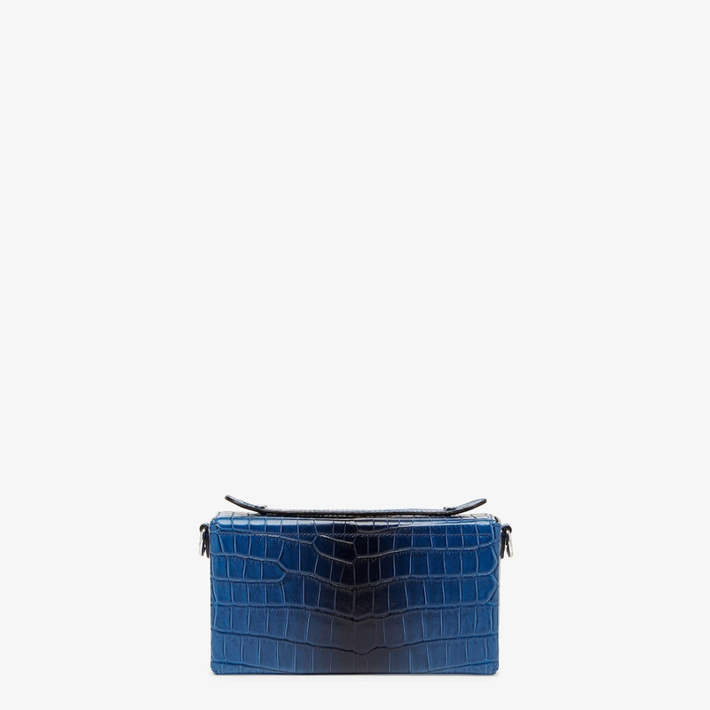 Soft Trunk Baguette bag made of exquisite matte crocodile leather in graduated blue tones. Flap with 3