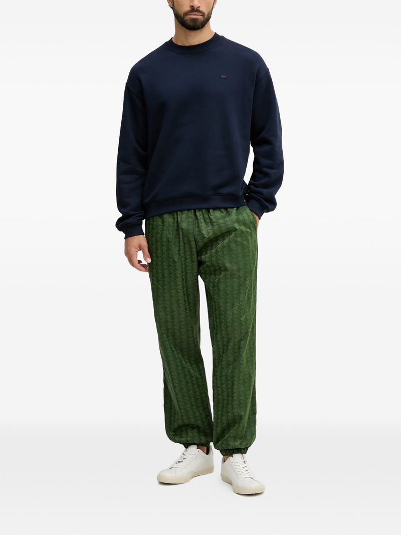 LACOSTE geometric-pattern track pants outlook