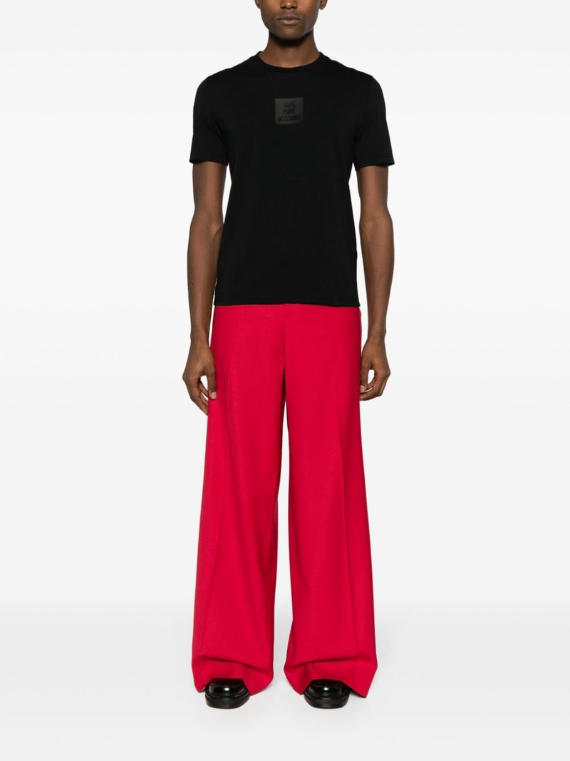 Moschino slogan-appliquÃ© T-shirt outlook