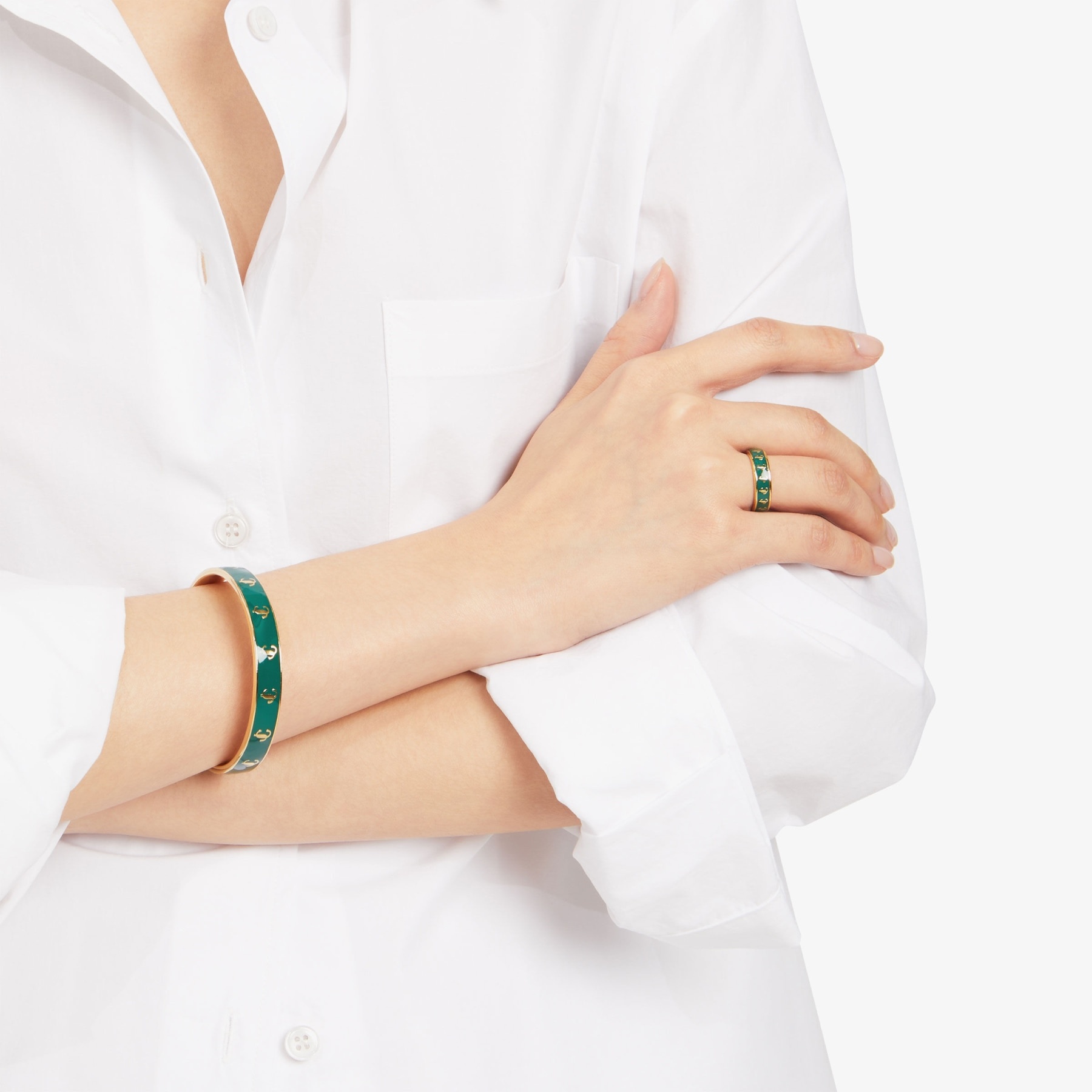 JC Enamel Bangle
Gold-Finish Metal and Emerald Enamel JC Bangle - 2