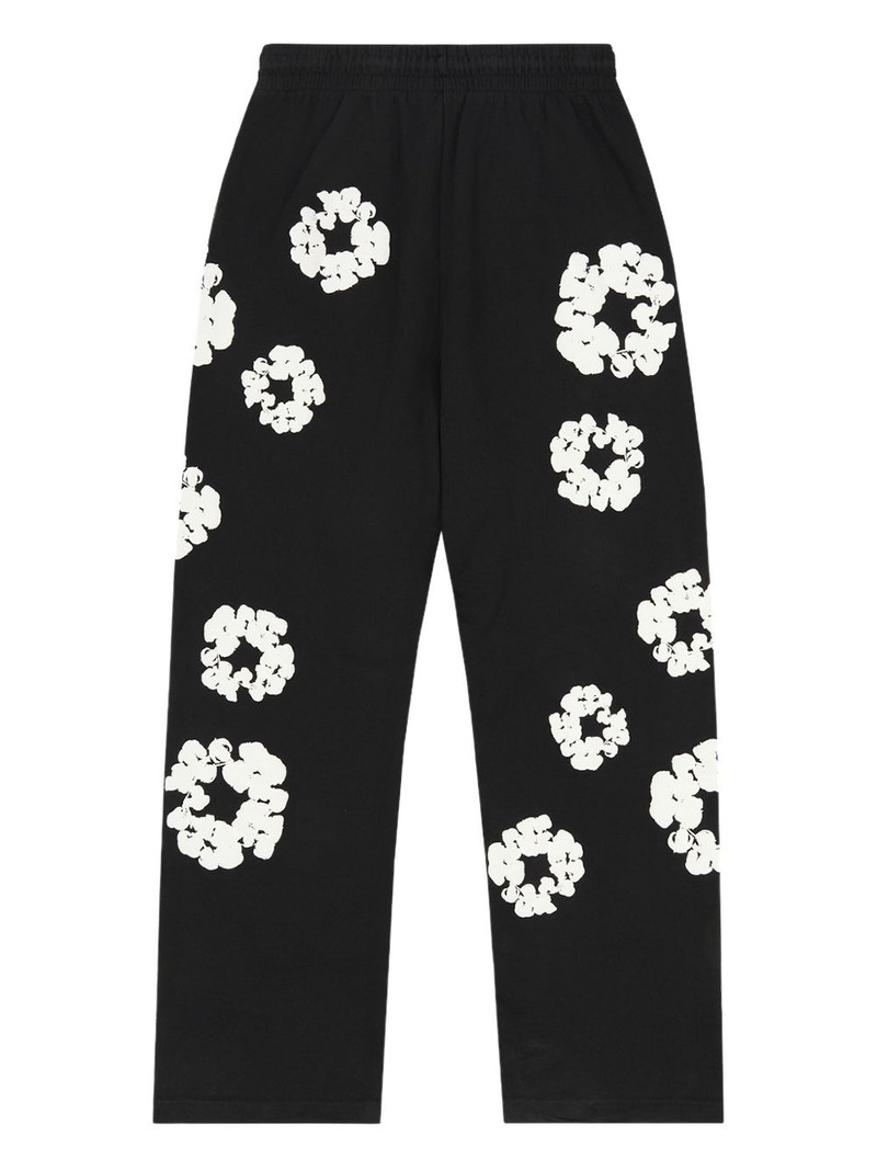 DENIM TEARS wreath-print track pants outlook