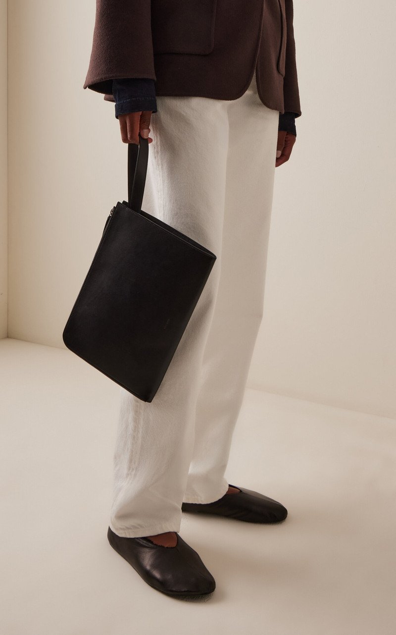 The Row Portfolio Medium Leather Wristlet black outlook
