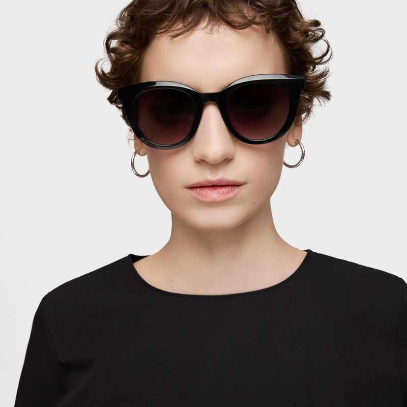 TOUS Black Sunglasses TOUS Round Logo outlook
