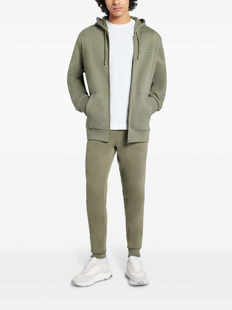 LACOSTE logo-appliquÃ© track pants outlook