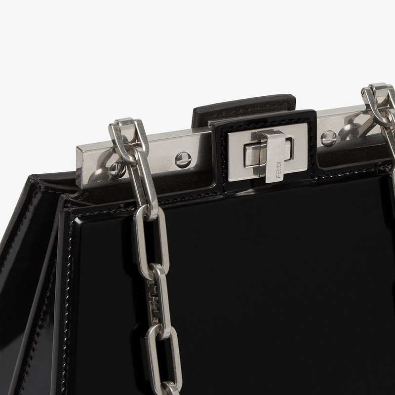 Compact Peekaboo Cut bag made of black leather. A new evolution of the Peekaboo ISeeU, it has a stri 5