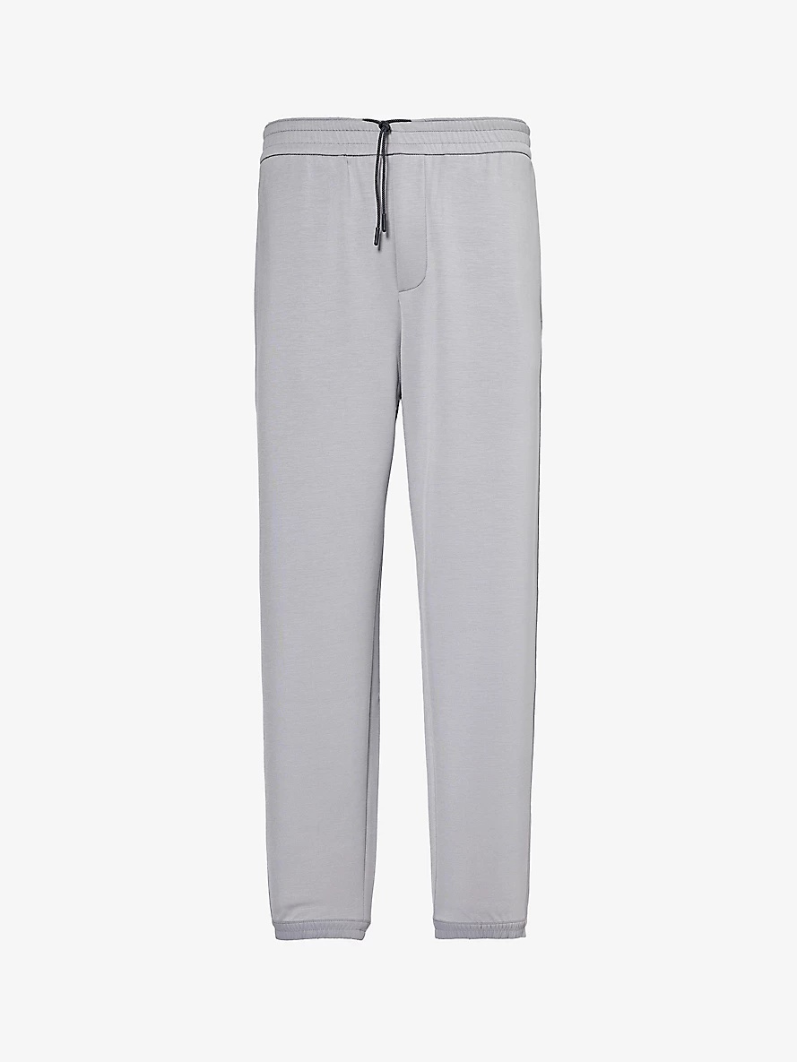 Logo-patch relaxed-fit stretch-woven blend jogging bottoms - 1