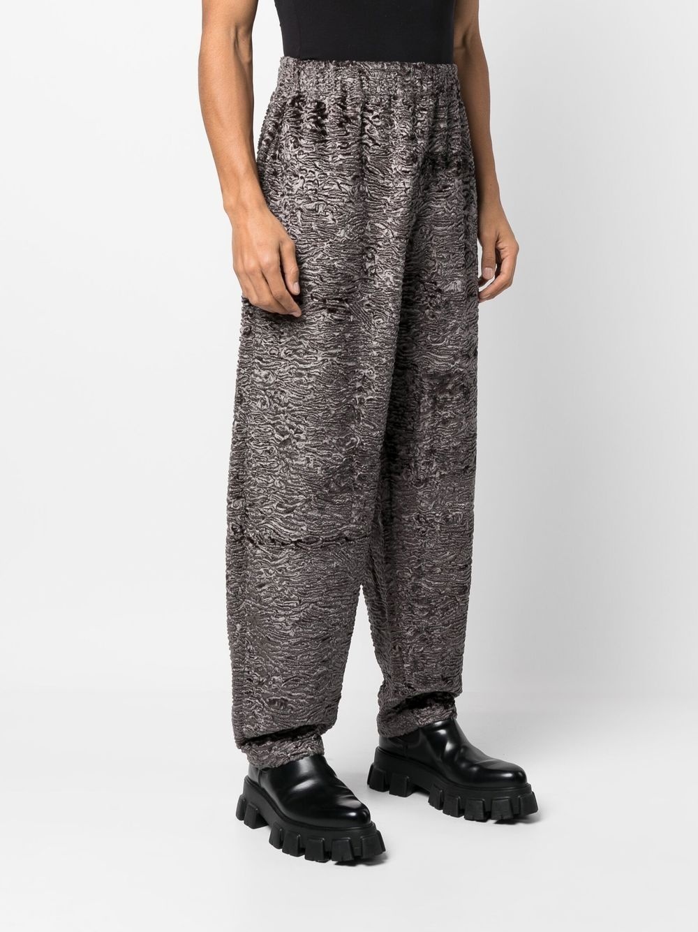 all-over graphic-print trousers - 4