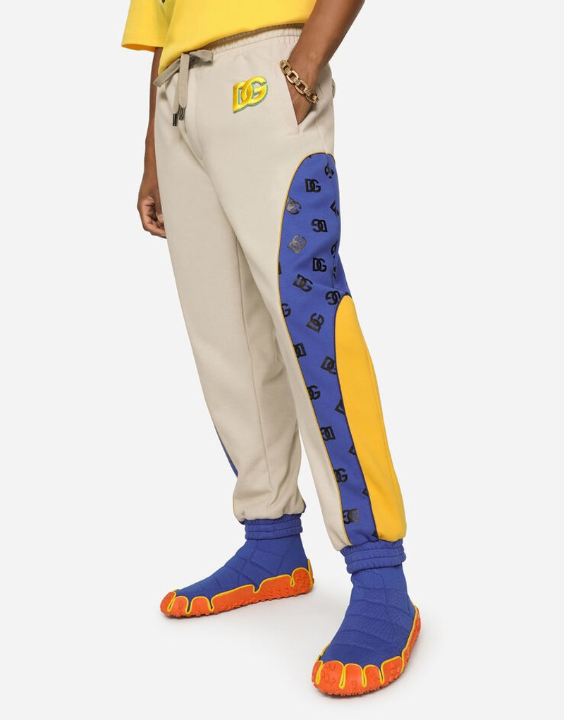 Dolce & Gabbana Jogging pants with embroidered DG patch and print outlook