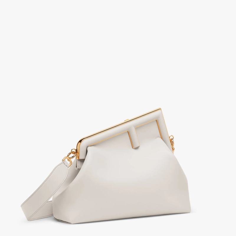 FENDI Medium Fendi First bag in light gray soft nappa leather with an oversized F metal clasp with tone on outlook