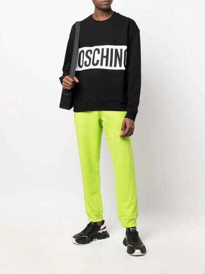 Moschino logo-print track pants outlook