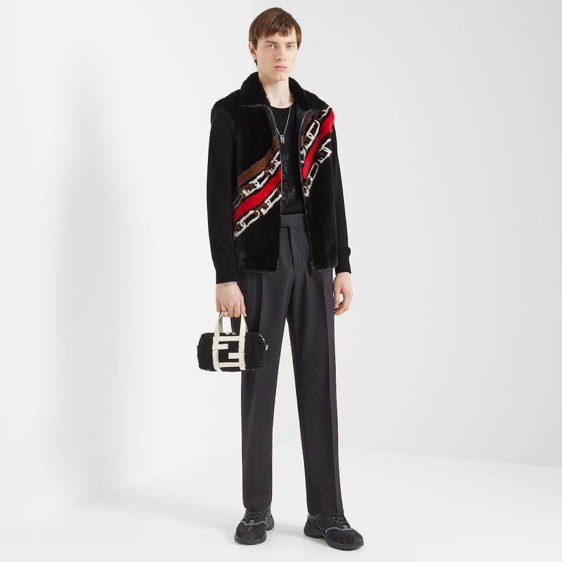 FENDI Gilet with high collar. Welt pockets. Zip fastening with double slider. Made of black mink. Embellis outlook