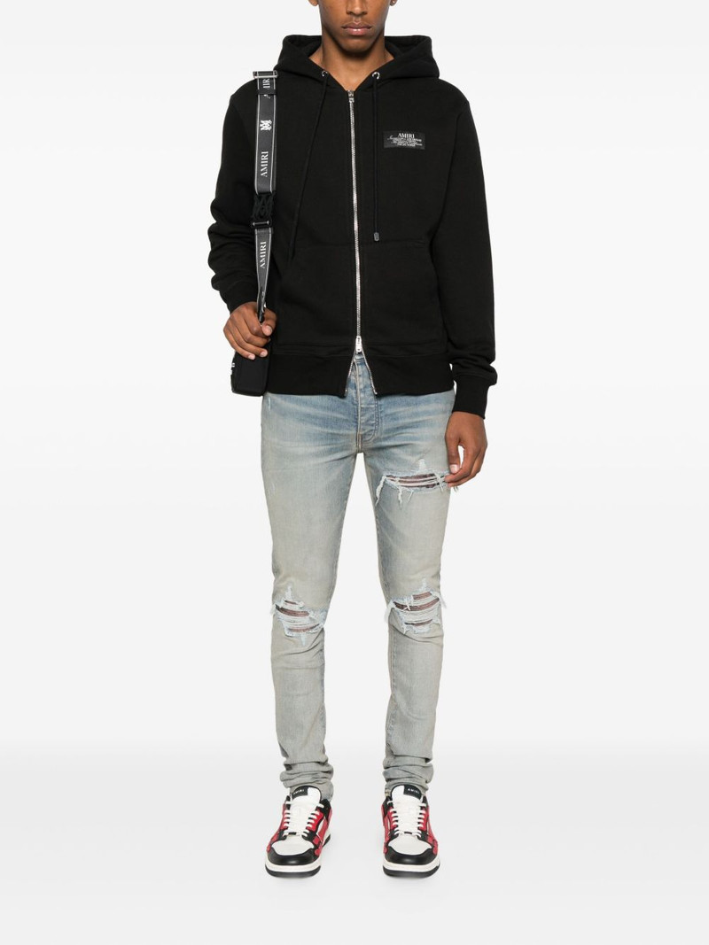 AMIRI leather-trimmed jeans outlook