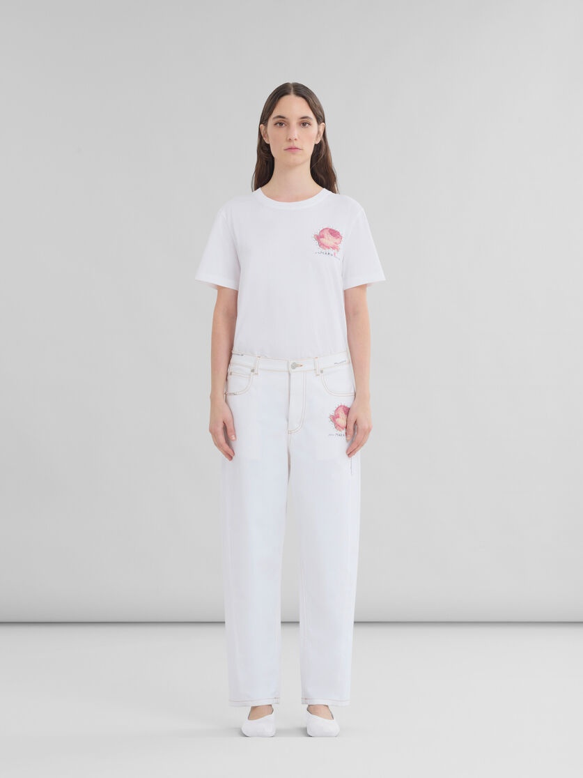 WHITE DENIM TROUSERS WITH FLOWER PATCH - 2