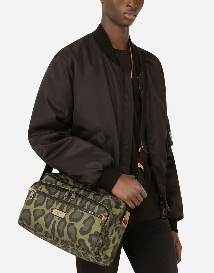 Nylon messenger bag with a leopard print against a green background and branded plate - 6