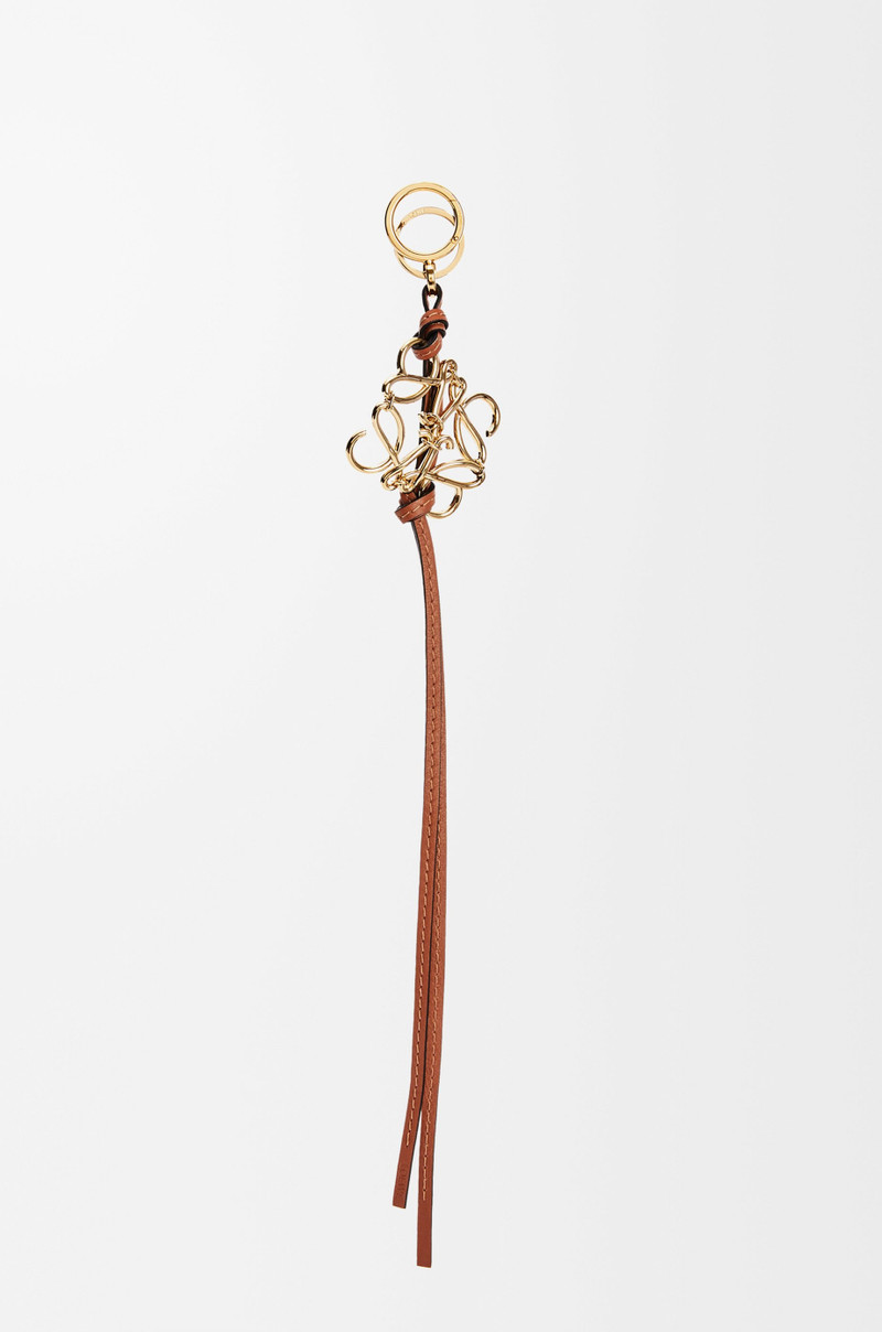 Anagram charm in metal and calfskin 1