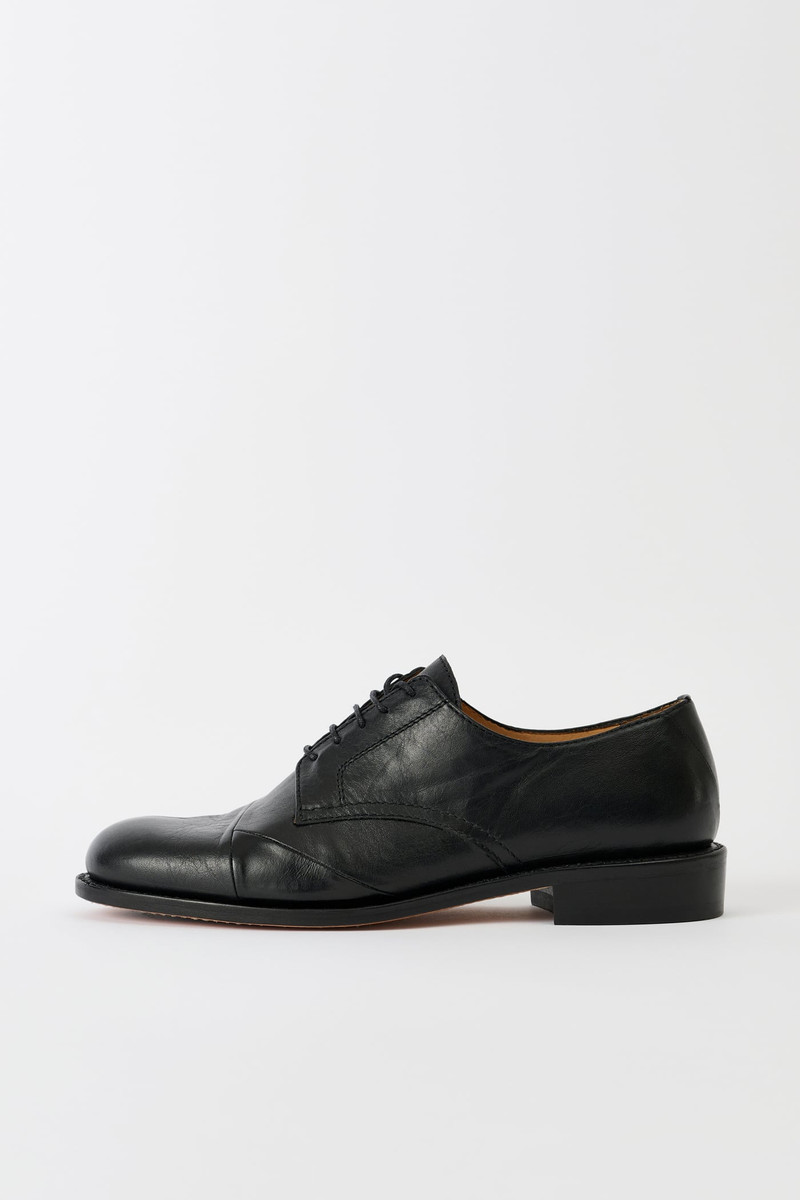 Patched Parade Malleable Black Bull Hide 1