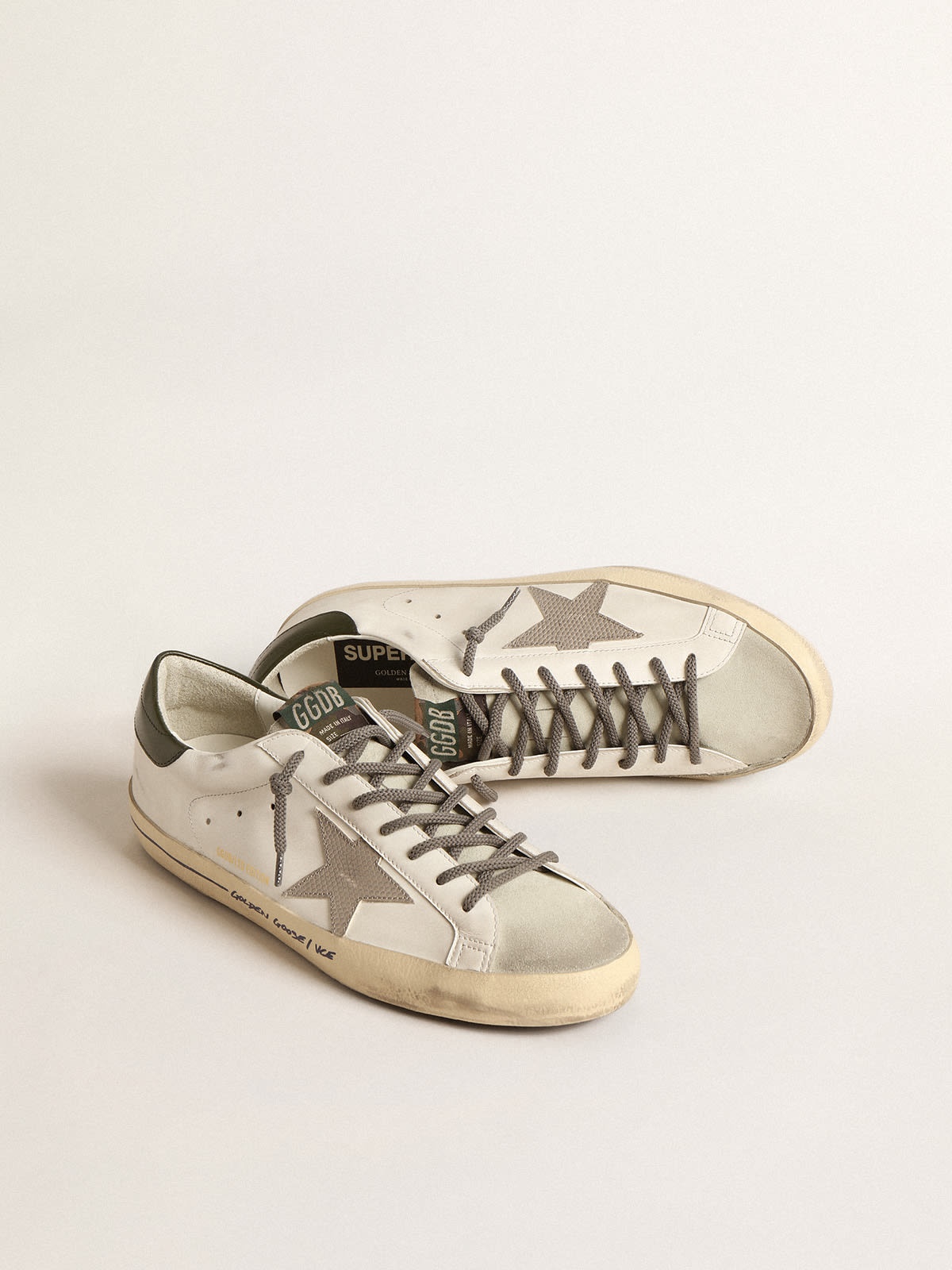 Men's Super-Star with black heel tab and metal stud lettering