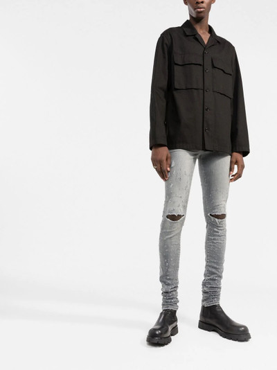 AMIRI distressed skinny jeans outlook