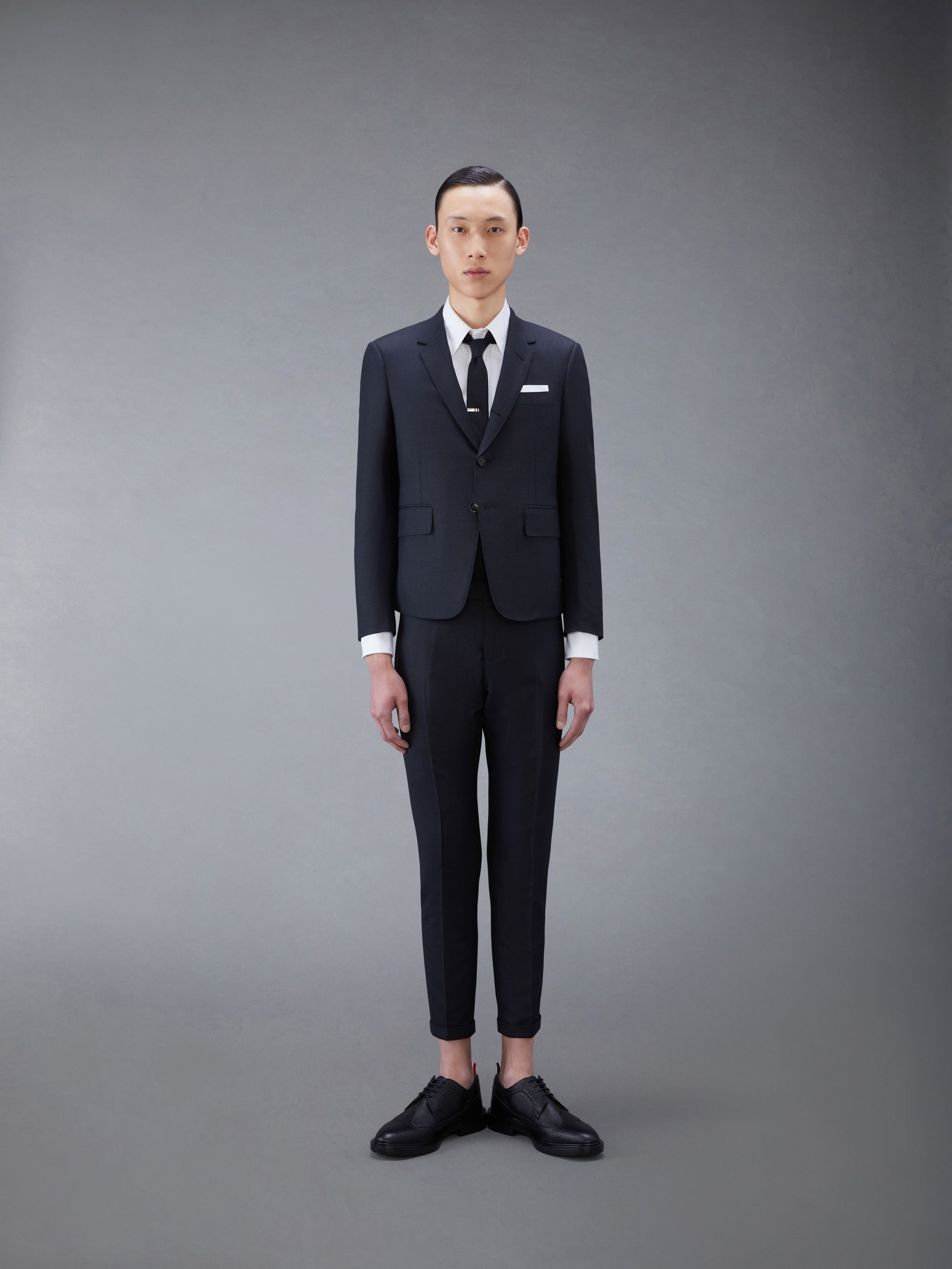 CHARCOAL GREY SUPER 120S TWILL HIGH ARMHOLE SUIT WITH TIE AND LOW RISE SKINNY TROUSER - 1