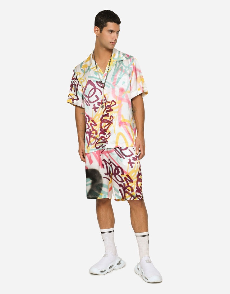 Silk jogging shorts with spray-paint graffiti print - 1
