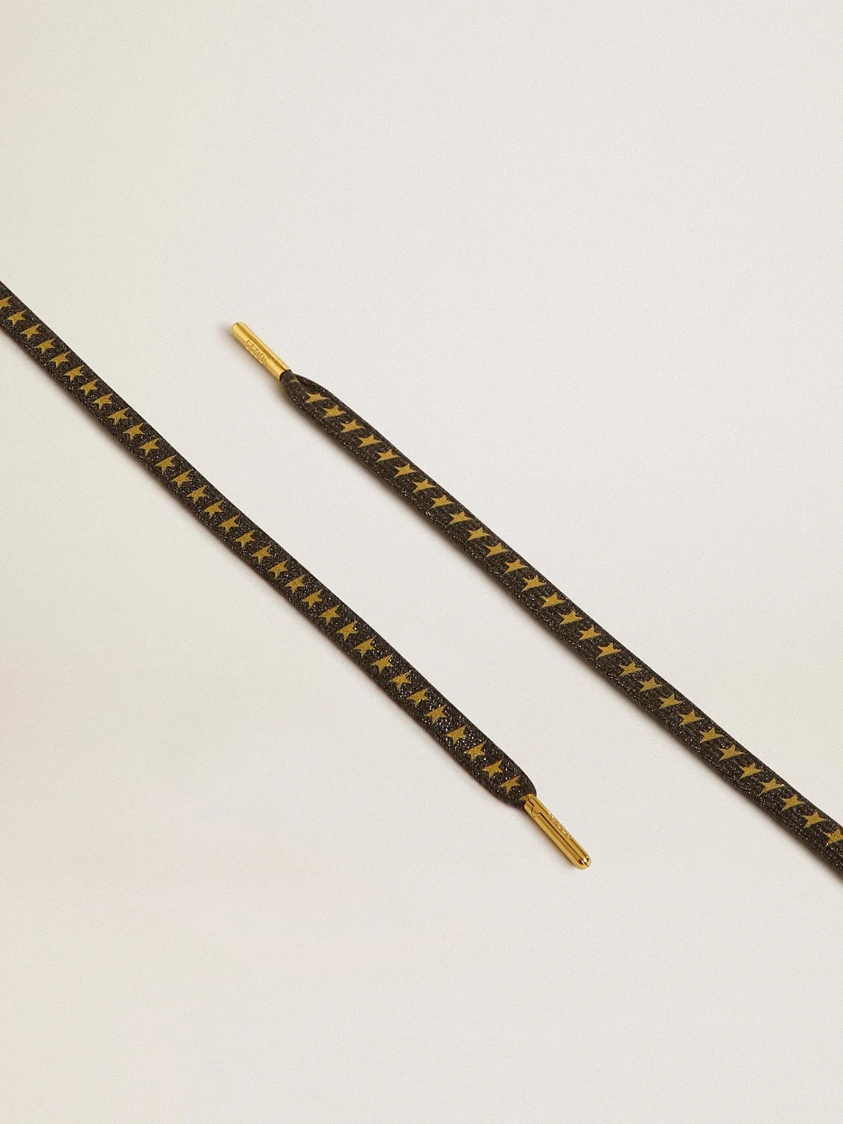 Dark gray Lurex laces with contrasting gold stars - 1