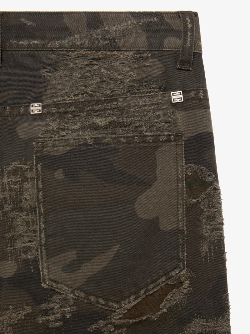 SLIM-FIT IN DESTROYED DENIM WITH PRINTED CAMO 6