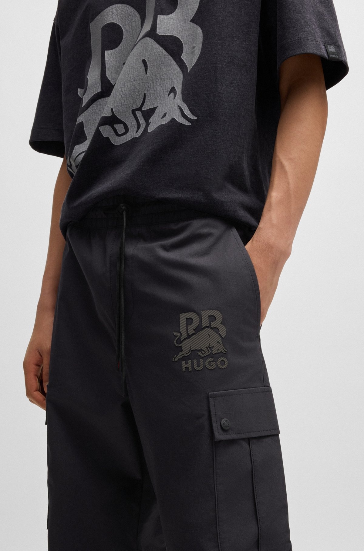 HUGO HUGO X RB REGULAR-FIT TROUSERS WITH CARBON STEALTH LOGO | REVERSIBLE