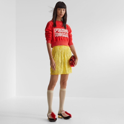 FENDI Long-sleeved cropped sweatshirt. Made of red jersey decorated with the Fendi Roma logo reinterpreted outlook